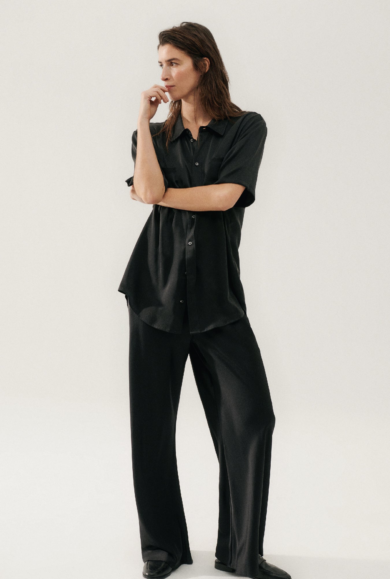 Silk Laundry Bias Cut Pants in black silk, shown full length on model and styled for day